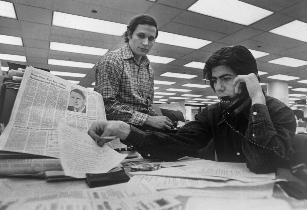 Bob Woodward and Carl Bernstein working at the Washington Post